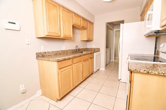 an aerial view of residential building and lake