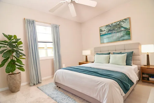 a bedroom with bed and a window