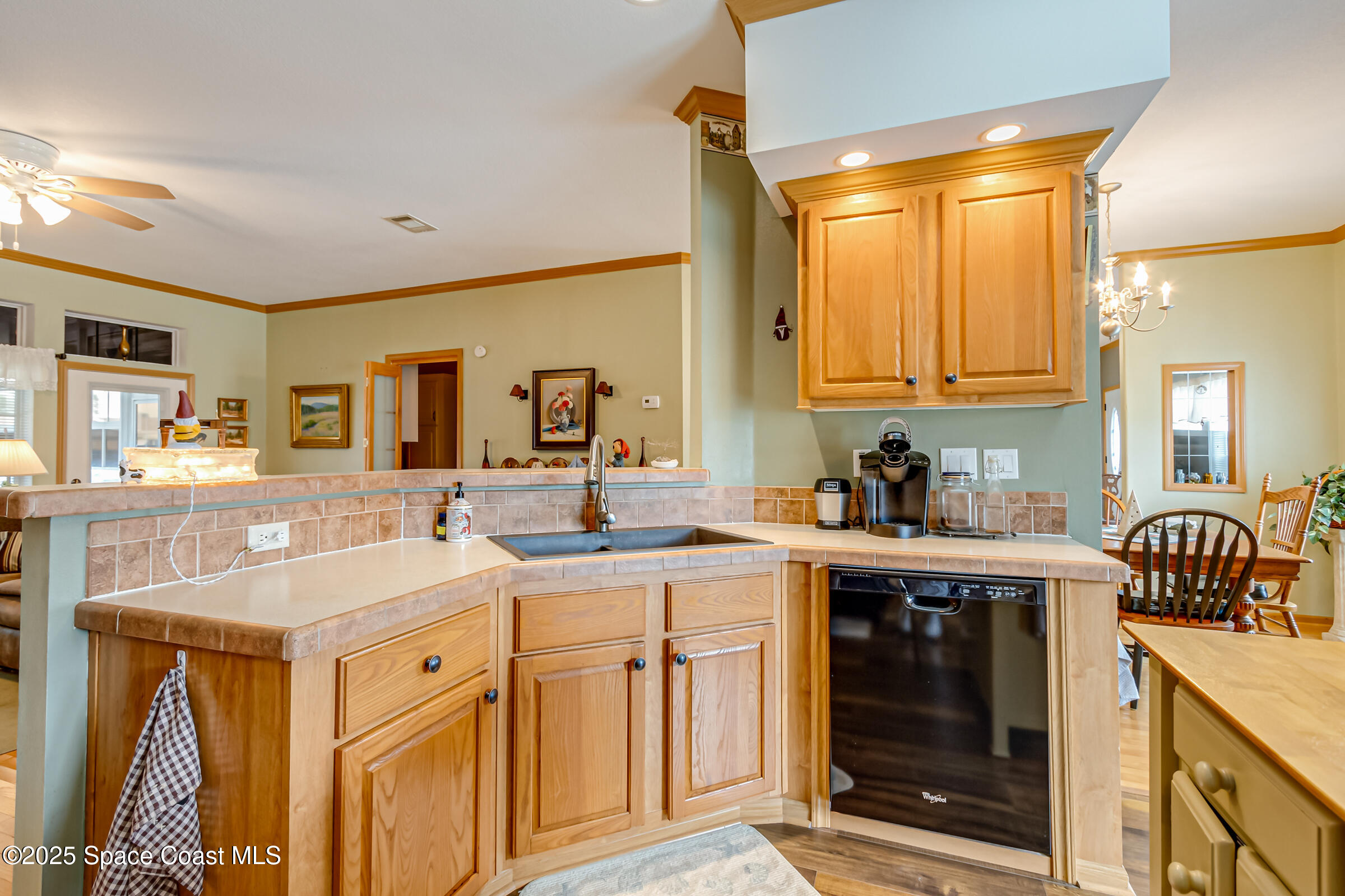 694 Outer Drive, Unit 184 Cocoa, FL 32926 - Photo 13 of 38 a kitchen with a sink stove and cabinets