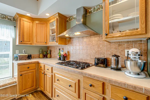 a kitchen with a stove and cabinets
