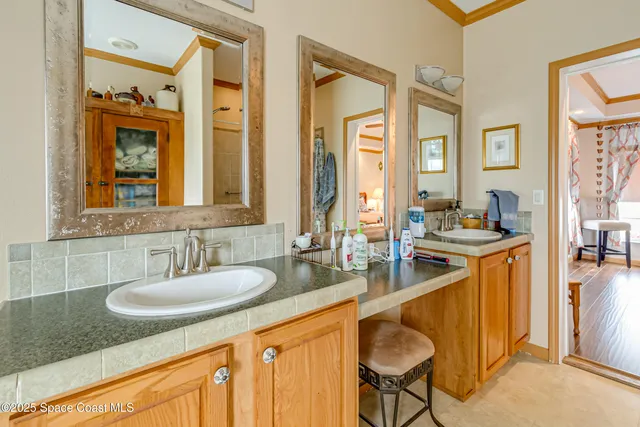a bathroom with a sink double vanity and a mirror