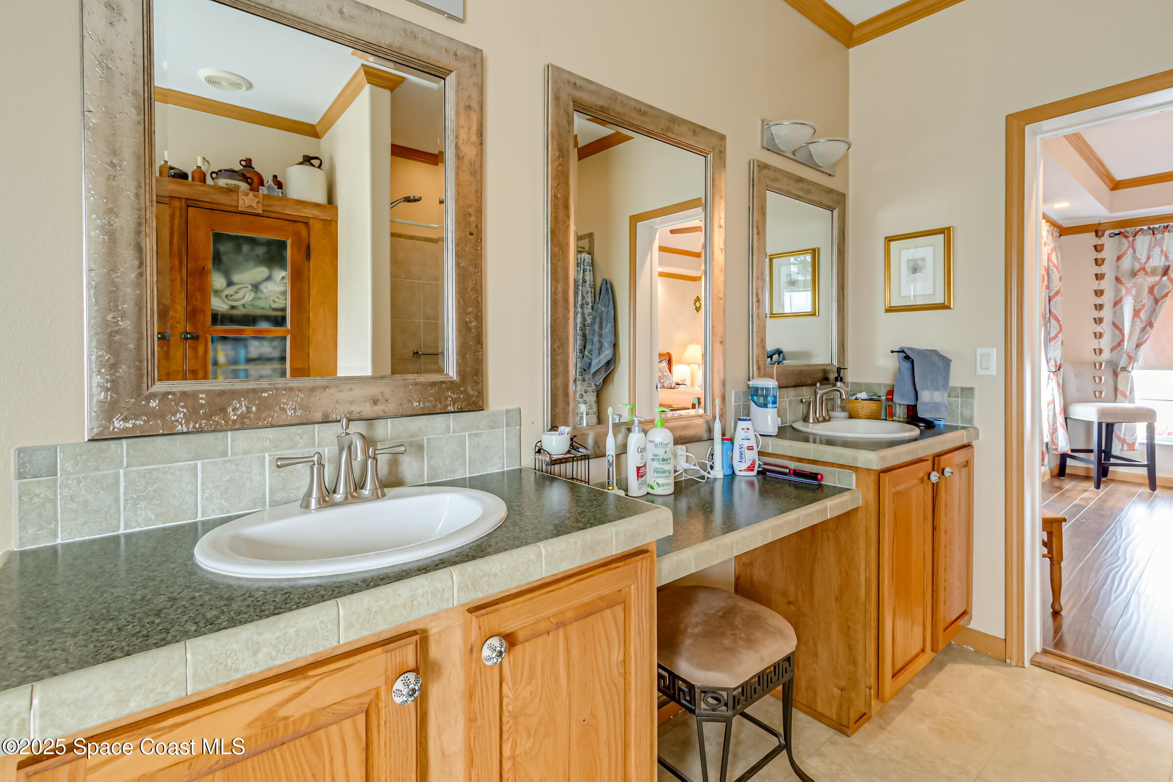 694 Outer Drive, Unit 184 Cocoa, FL 32926 - Photo 17 of 38 a bathroom with a sink double vanity and a mirror