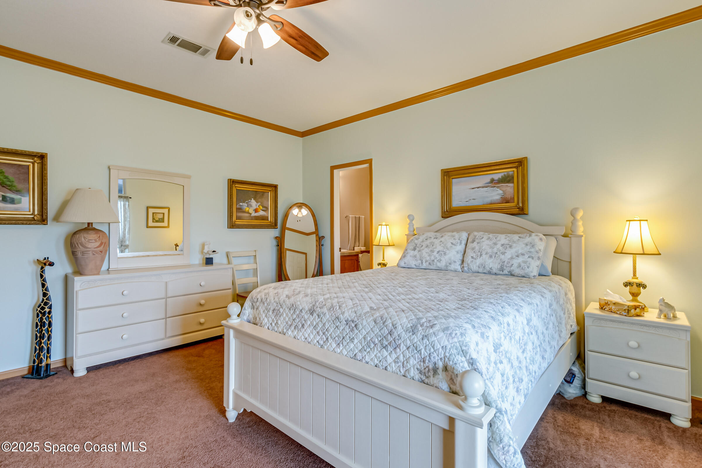 694 Outer Drive, Unit 184 Cocoa, FL 32926 - Photo 20 of 38 a bedroom with a bed and a dresser