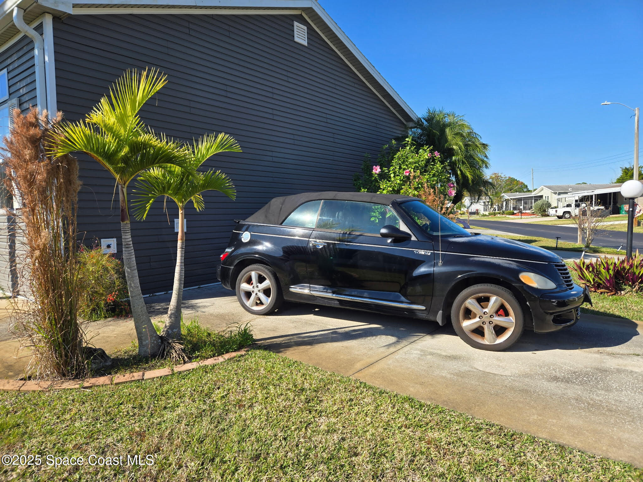 694 Outer Drive, Unit 184 Cocoa, FL 32926 - Photo 2 of 38 a car parked in front of a house