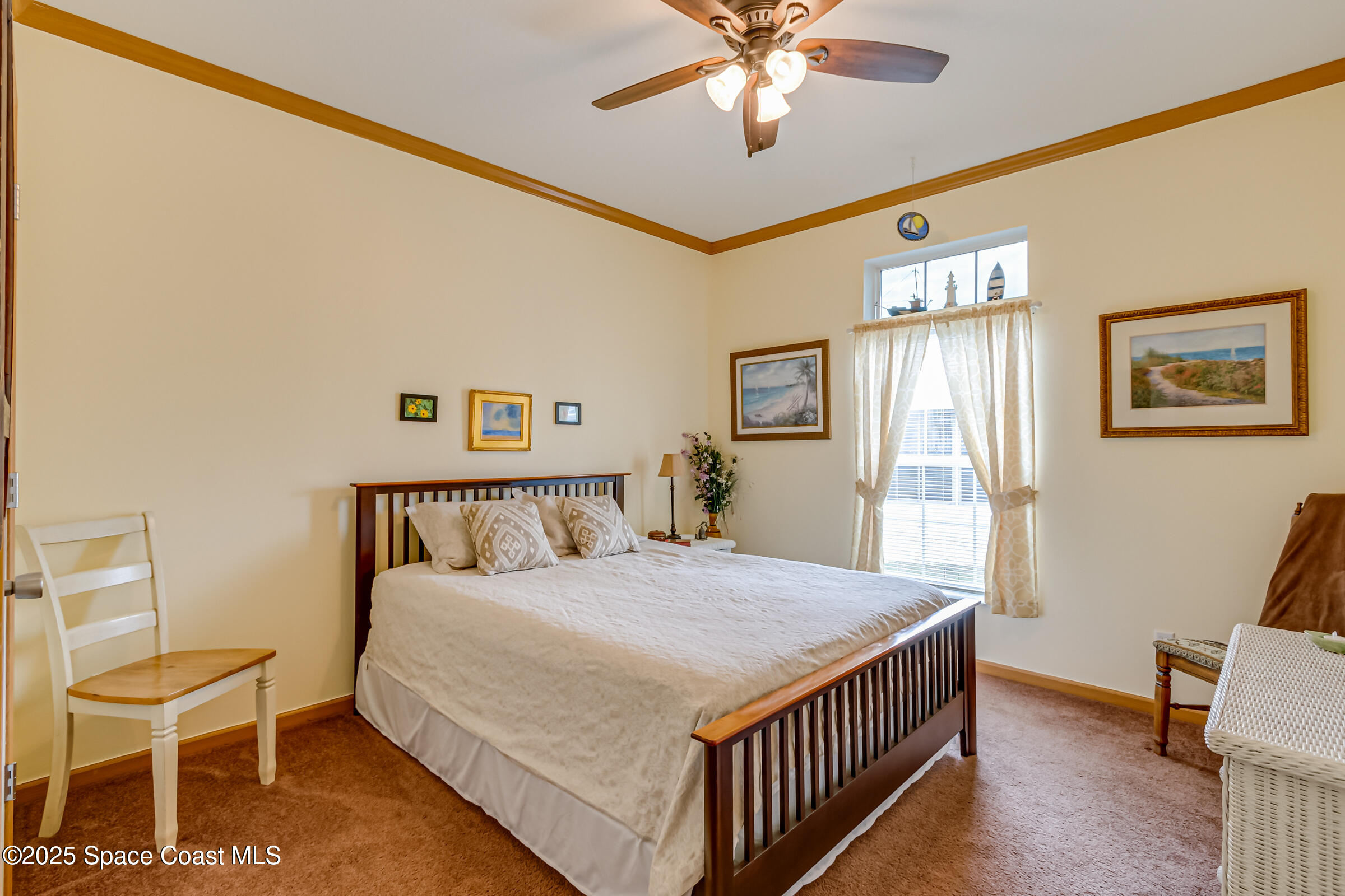 694 Outer Drive, Unit 184 Cocoa, FL 32926 - Photo 22 of 38 a bed sitting in a bedroom next to a window