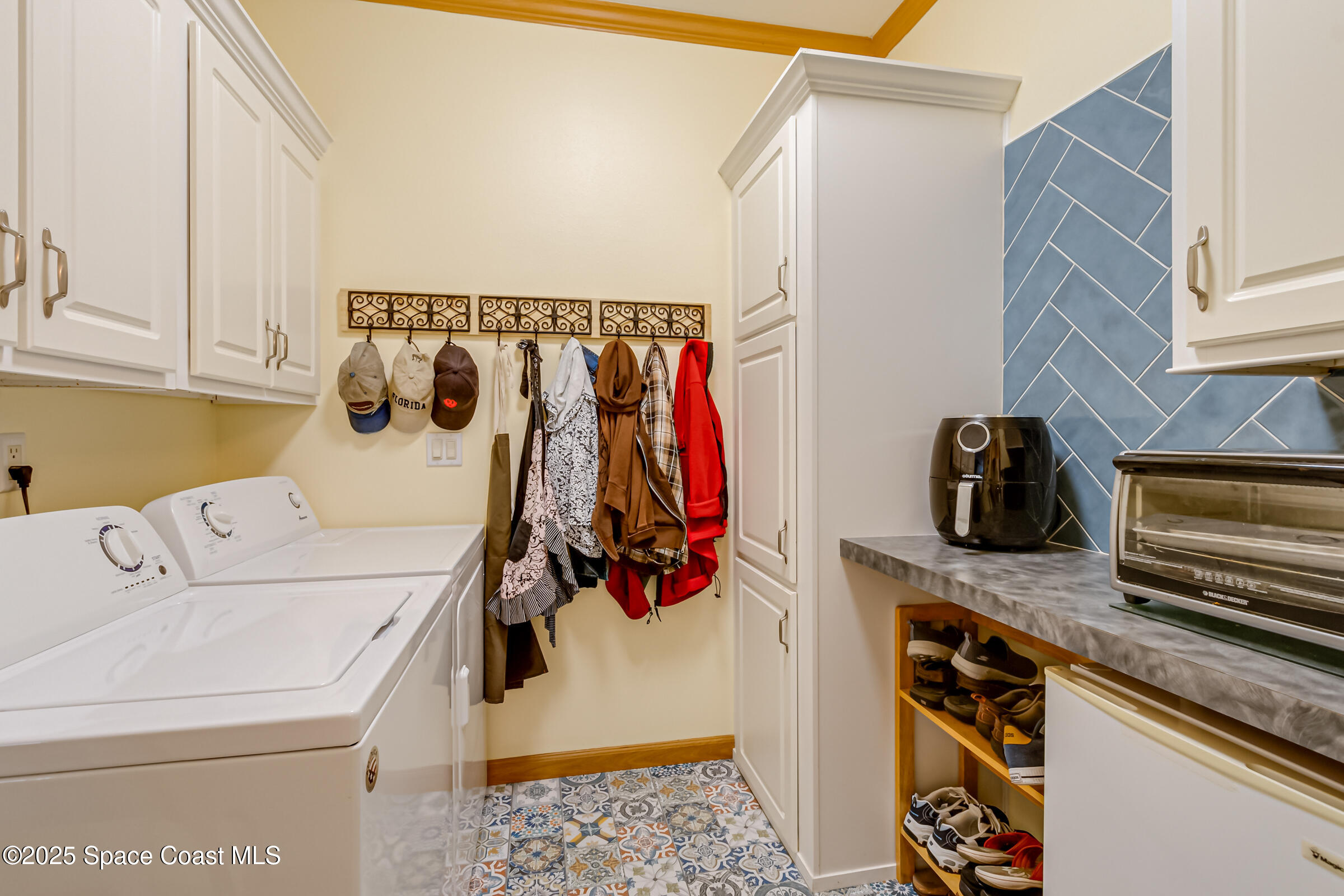 694 Outer Drive, Unit 184 Cocoa, FL 32926 - Photo 24 of 38 a utility room with dryer and washer