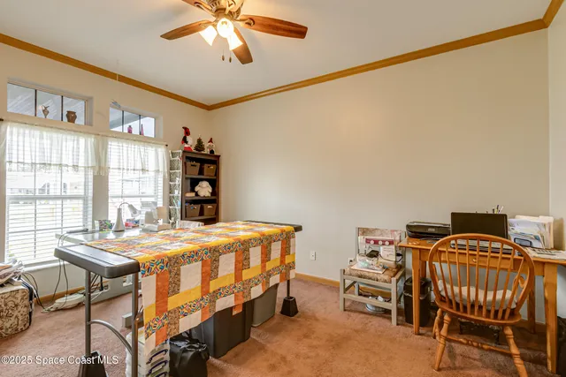 a bedroom that has a bed and a table in it