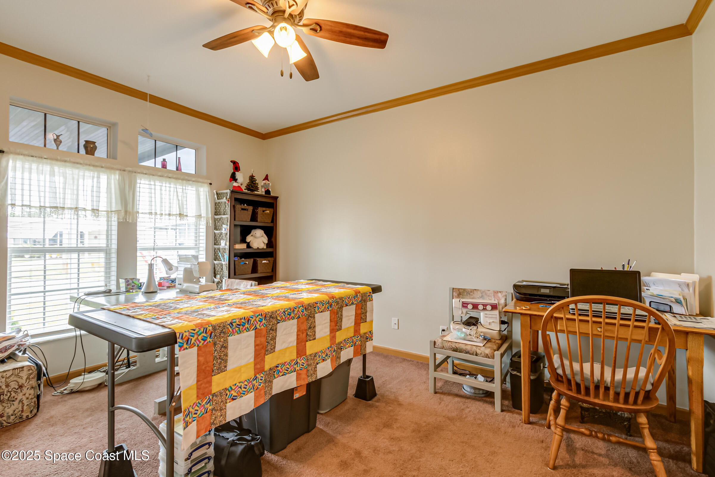 694 Outer Drive, Unit 184 Cocoa, FL 32926 - Photo 25 of 38 a bedroom that has a bed and a table in it