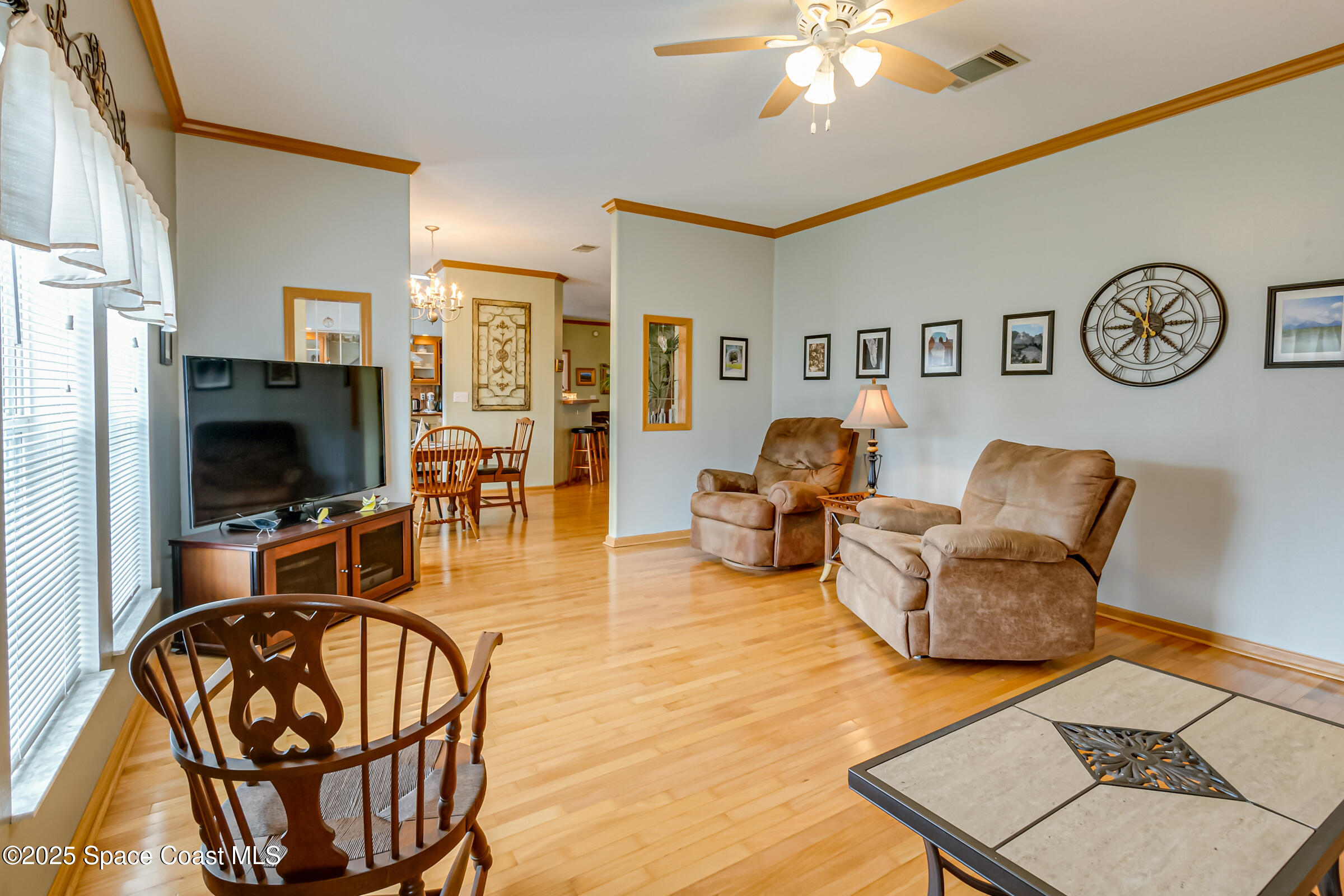 694 Outer Drive, Unit 184 Cocoa, FL 32926 - Photo 27 of 38 a living room with furniture and a flat screen tv