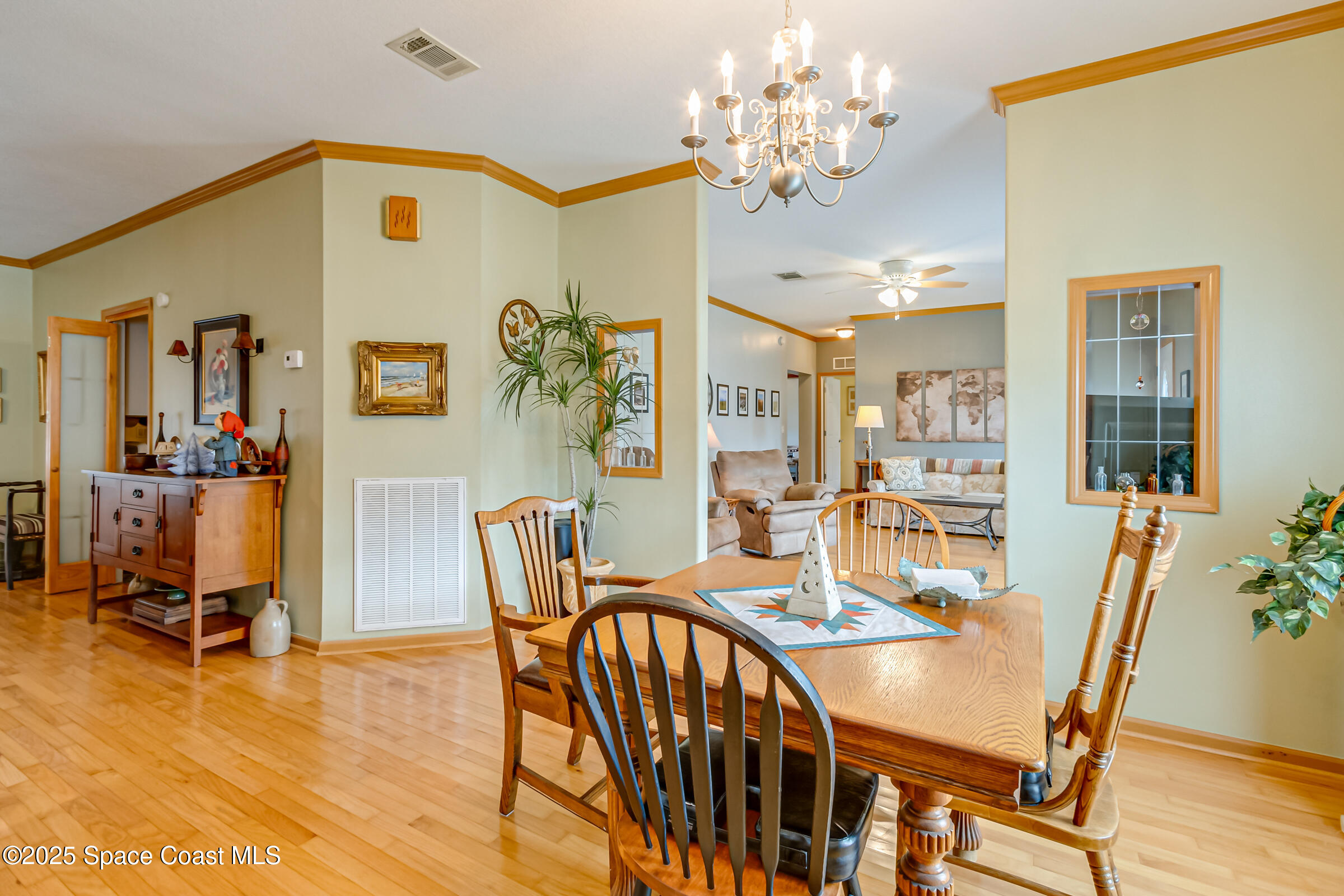 694 Outer Drive, Unit 184 Cocoa, FL 32926 - Photo 34 of 38 a view of a dining room with furniture and wooden floor