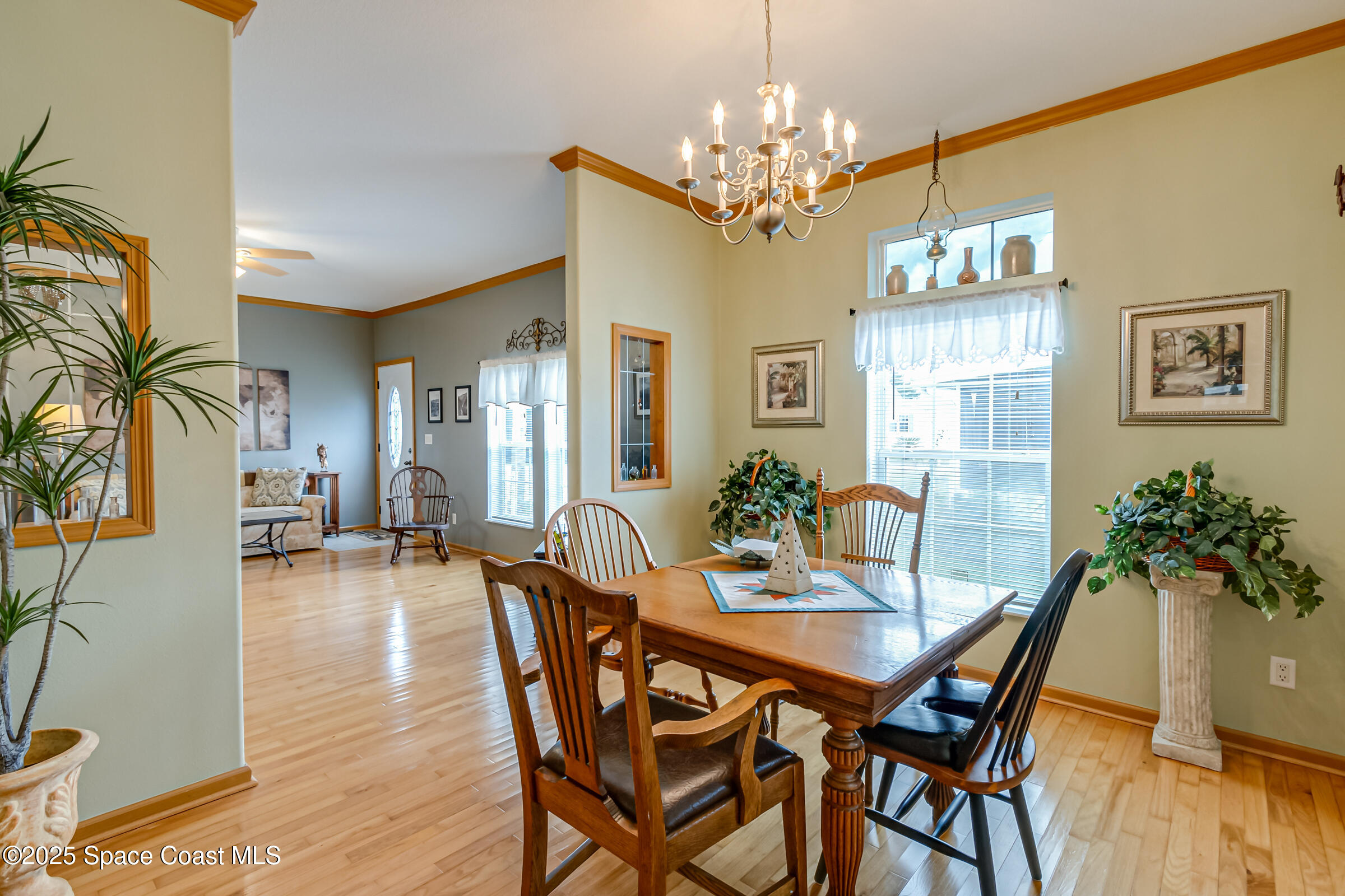 694 Outer Drive, Unit 184 Cocoa, FL 32926 - Photo 35 of 38 a view of a dining room with furniture window and wooden floor