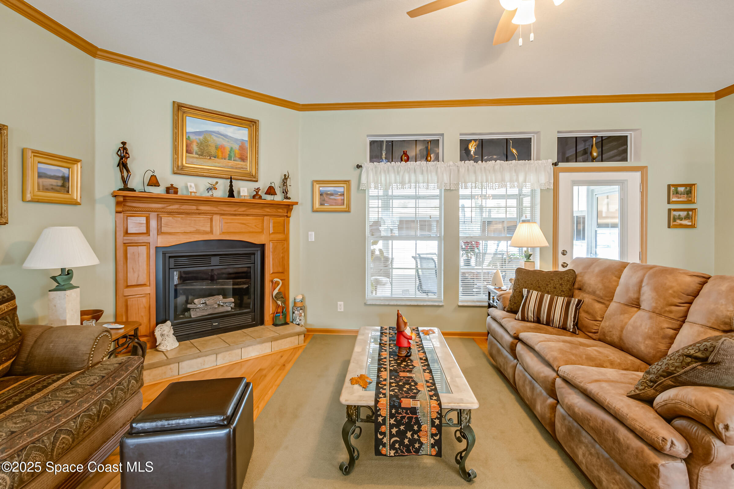 694 Outer Drive, Unit 184 Cocoa, FL 32926 - Photo 9 of 38 a living room with furniture or couch and a fireplace