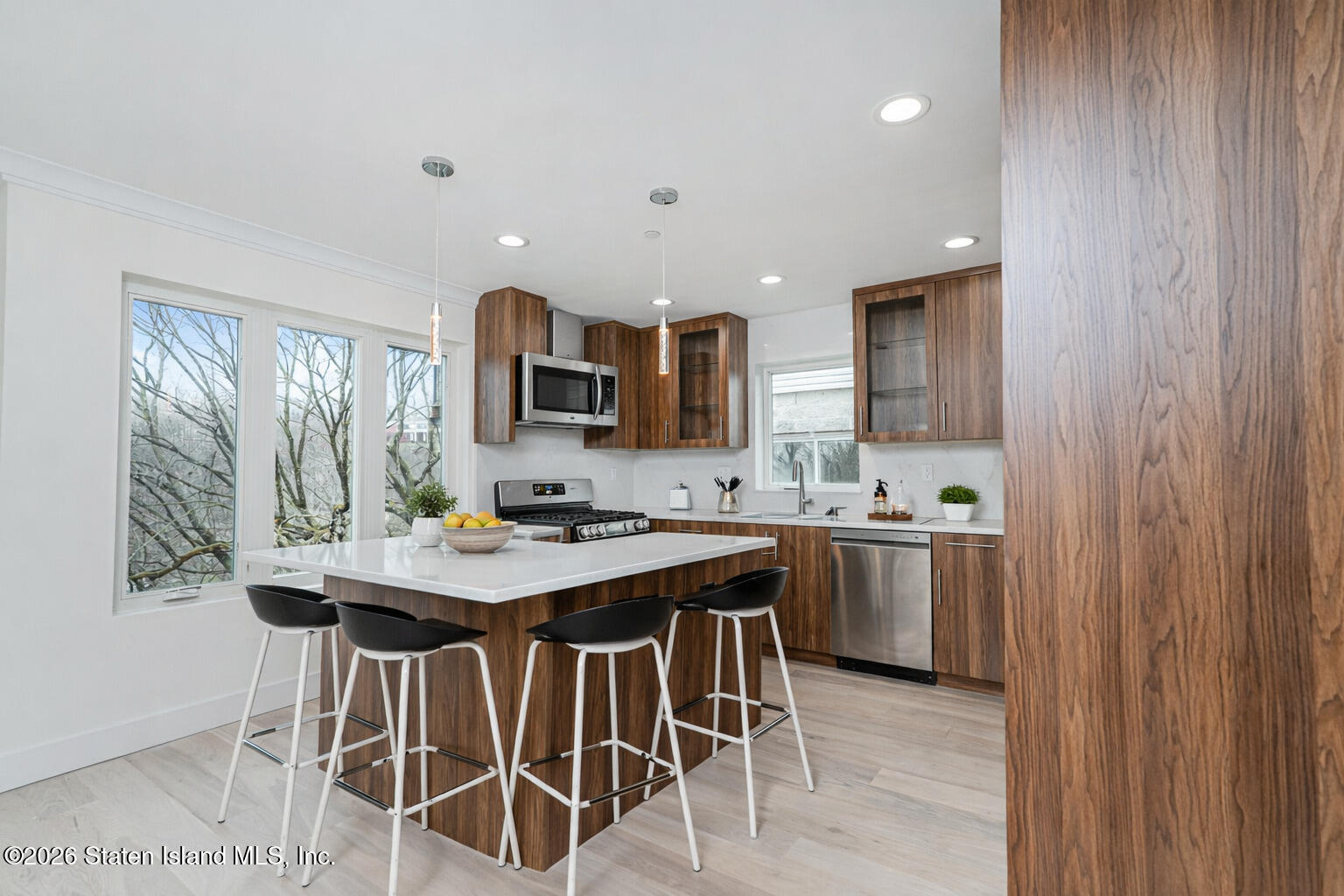 54 Cedarcliff Road Staten Island, NY 10301 - Photo 12 of 49 a kitchen with stainless steel appliances granite countertop a sink a stove and a refrigerator