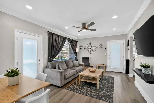 a living room with furniture and a large window