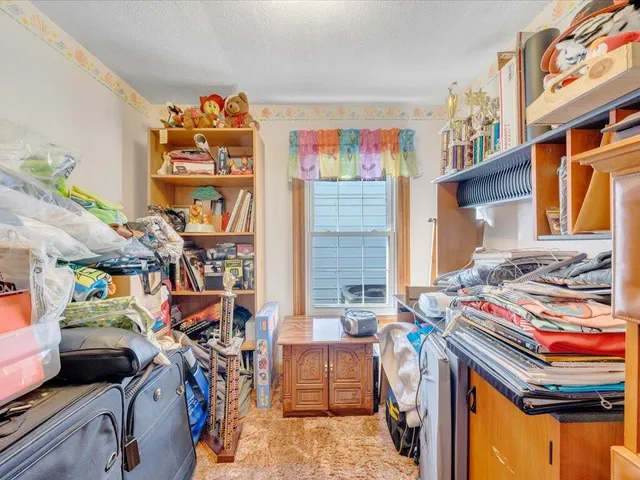 a utility room with dryer and bicycles