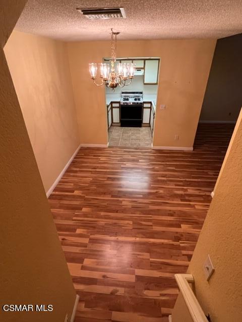 1225 Fitzgerald Road, Unit E Simi Valley, CA 93065 - Photo 24 of 30 a view of kitchen and living room with wooden floor