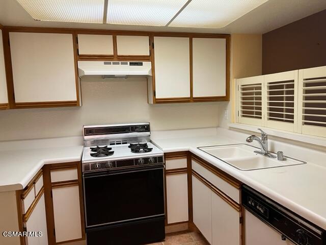 1225 Fitzgerald Road, Unit E Simi Valley, CA 93065 - Photo 5 of 30 a kitchen with a stove and a sink