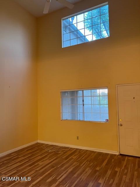1225 Fitzgerald Road, Unit E Simi Valley, CA 93065 - Photo 10 of 30 an empty room with wooden floor and windows