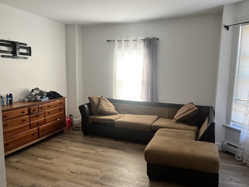 95-97 Tenney Street Methuen, MA 01844 - Photo 11 of 19 a living room with furniture and a window