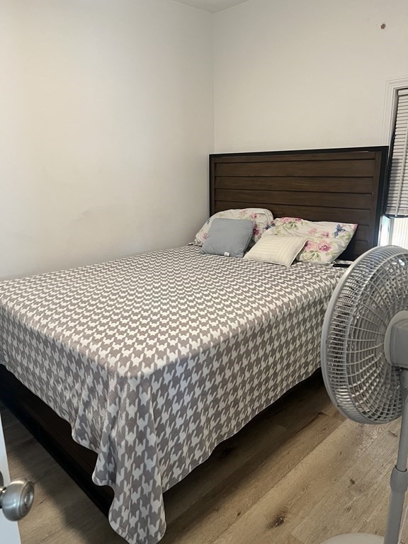 95-97 Tenney Street Methuen, MA 01844 - Photo 13 of 19 a bed sitting in a bedroom next to a window
