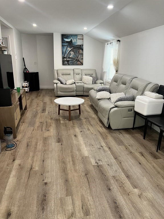 95-97 Tenney Street Methuen, MA 01844 - Photo 14 of 19 a living room with furniture and a wooden floor