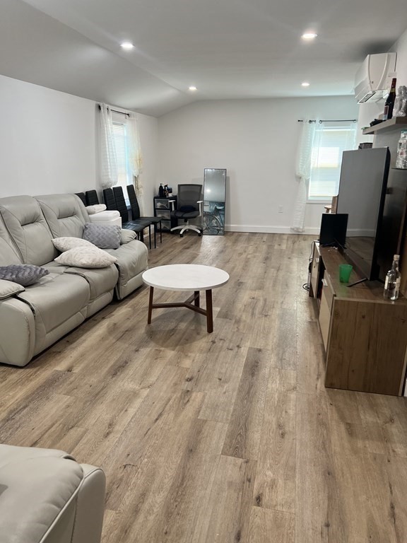95-97 Tenney Street Methuen, MA 01844 - Photo 15 of 19 a living room with furniture and a flat screen tv