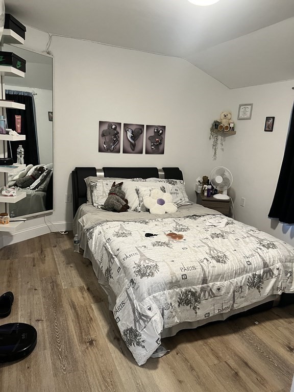 95-97 Tenney Street Methuen, MA 01844 - Photo 16 of 19 a bedroom with a bed and wooden floor