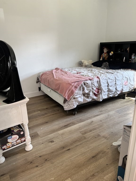 95-97 Tenney Street Methuen, MA 01844 - Photo 7 of 19 a bedroom with a bed and a dresser