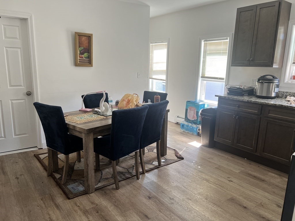 95-97 Tenney Street Methuen, MA 01844 - Photo 9 of 19 a view of a dining room with furniture and wooden floor