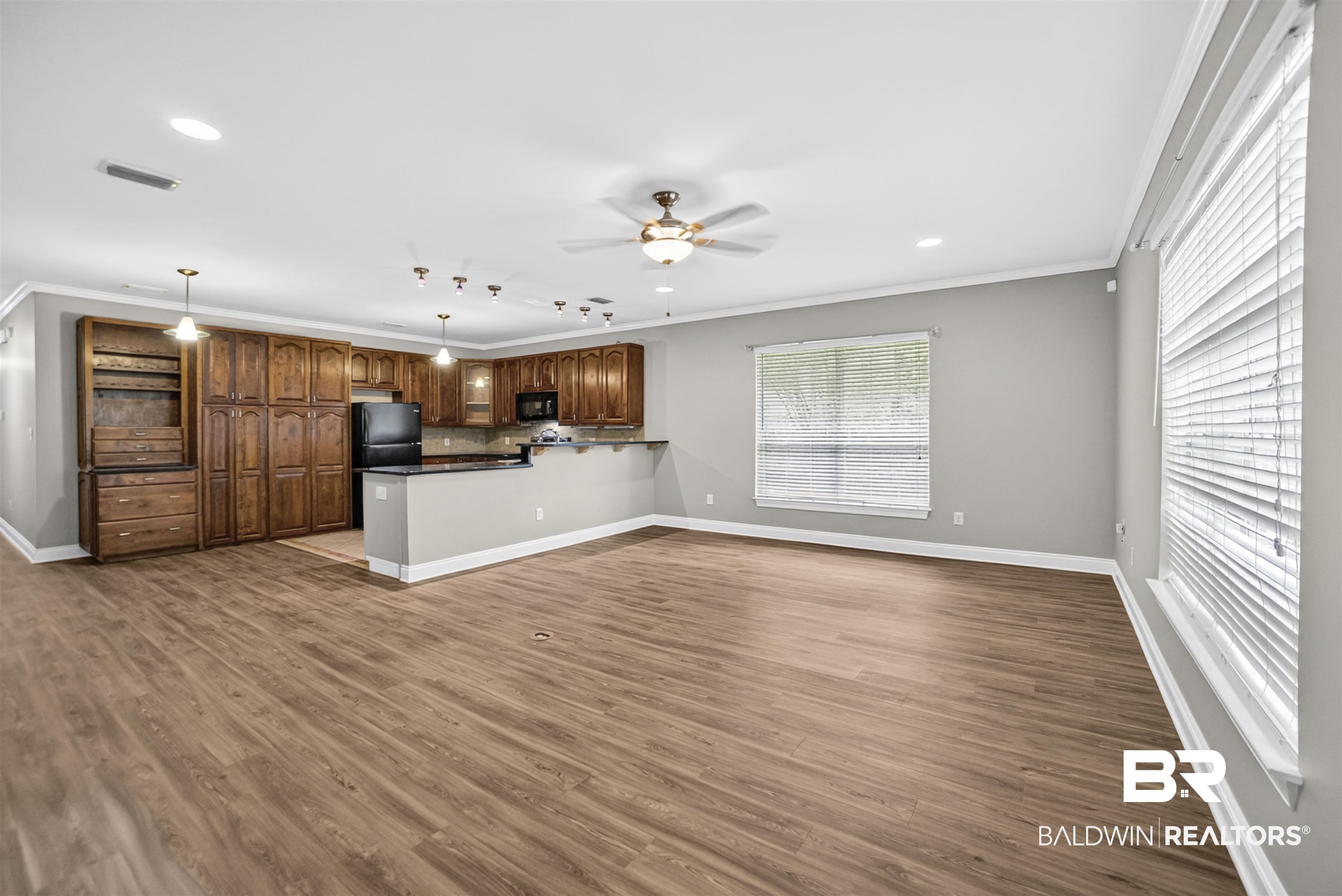 5913 Antoine Road Mobile, AL 36693 - Photo 7 of 33 Open-concept living space featuring wood-finish flooring, recessed lighting, and a ceiling fan
