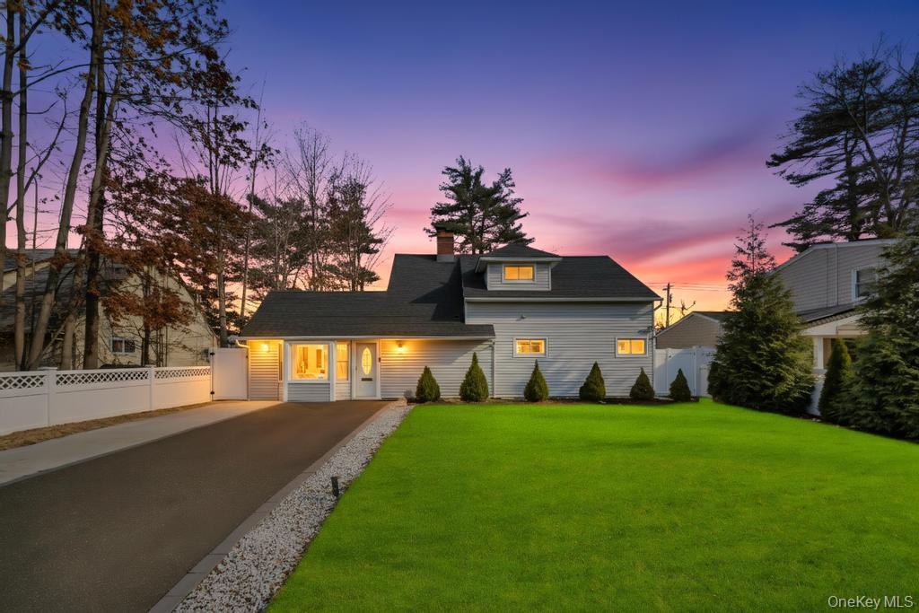 111 Blacksmith Road East Levittown, NY 11756 - Photo 1 of 14 View of front of home with a chimney and driveway