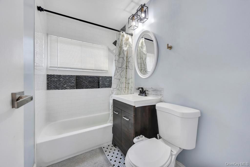 111 Blacksmith Road East Levittown, NY 11756 - Photo 10 of 14 Full bathroom featuring vanity and shower / tub combo