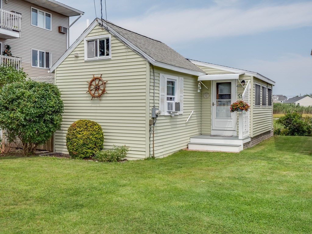 554 Winnacunnet Road, Unit A Hampton, NH 03842 - Photo 1 of 19 a view of a house with a yard