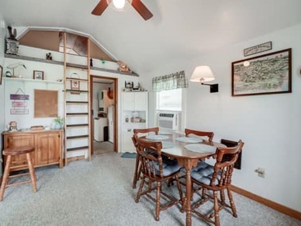 554 Winnacunnet Road, Unit A Hampton, NH 03842 - Photo 3 of 19 a view of a dining room with furniture and chandelier