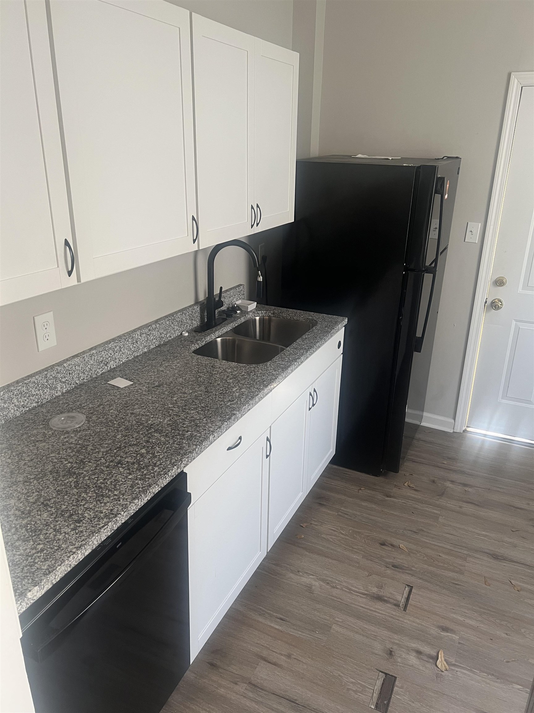 1353 Harbert Avenue Memphis, TN 38104 - Photo 10 of 18 a kitchen with a sink and a refrigerator