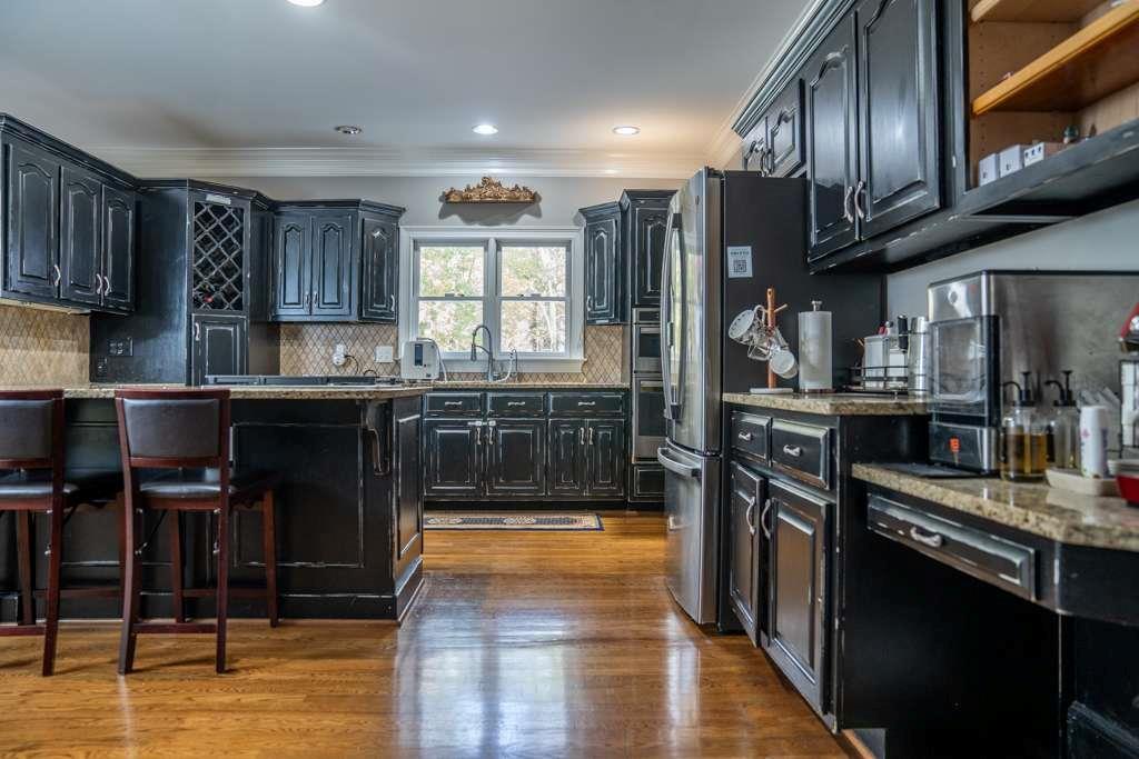 21 River Pine Drive Southwest Rome, GA 30165 - Photo 19 of 64 a kitchen with stainless steel appliances granite countertop a stove a sink and a refrigerator