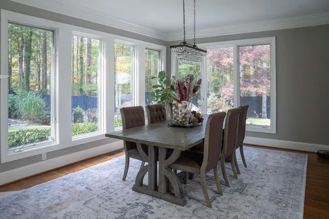 a bathroom with a granite countertop tub shower and sink