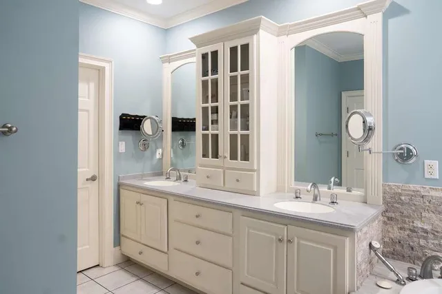 an empty room with window and a bathroom