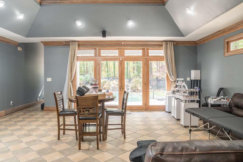 21 River Pine Drive Southwest Rome, GA 30165 - Photo 50 of 64 a dining room with furniture and large windows