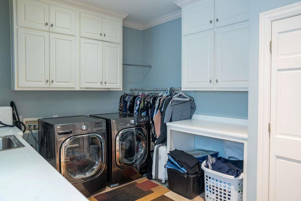21 River Pine Drive Southwest Rome, GA 30165 - Photo 55 of 64 a utility room with multiple dryer and washer