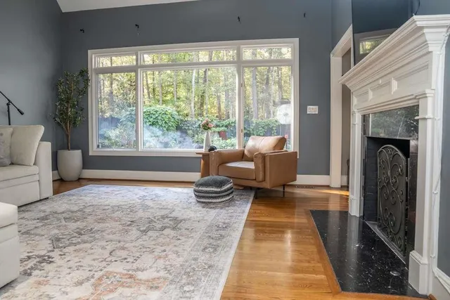 a view of porch with furniture and a large window