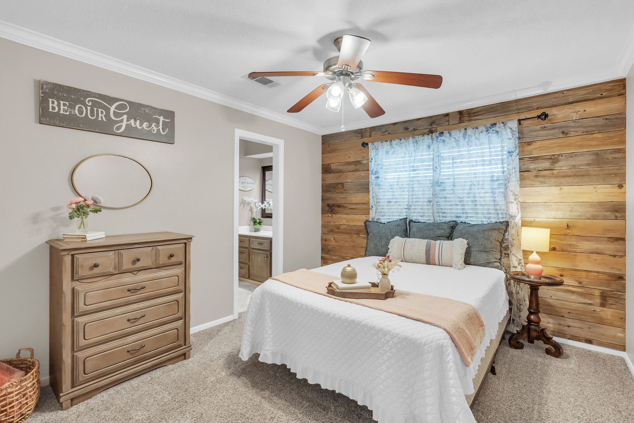 6034 Oak Creek Lane Spring, TX 77379 - Photo 29 of 42 Secondary Bedroom featuring a Wood Paneled Wall and a ceiling fan! 6034 Oak Creek Ln., Spring, TX 77379