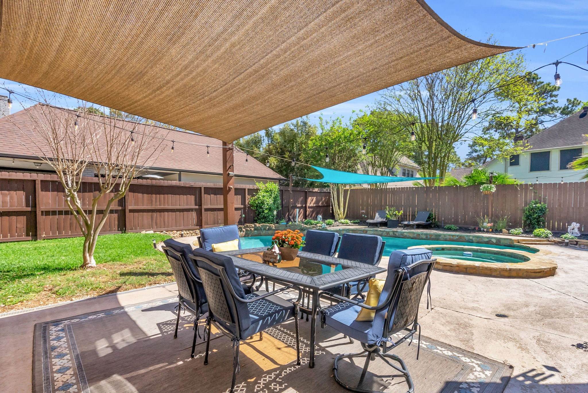 6034 Oak Creek Lane Spring, TX 77379 - Photo 34 of 42 A look at your Backyard featuring a Shade Sail covering the Outdoor Furniture! 6034 Oak Creek Ln., Spring, TX 77379