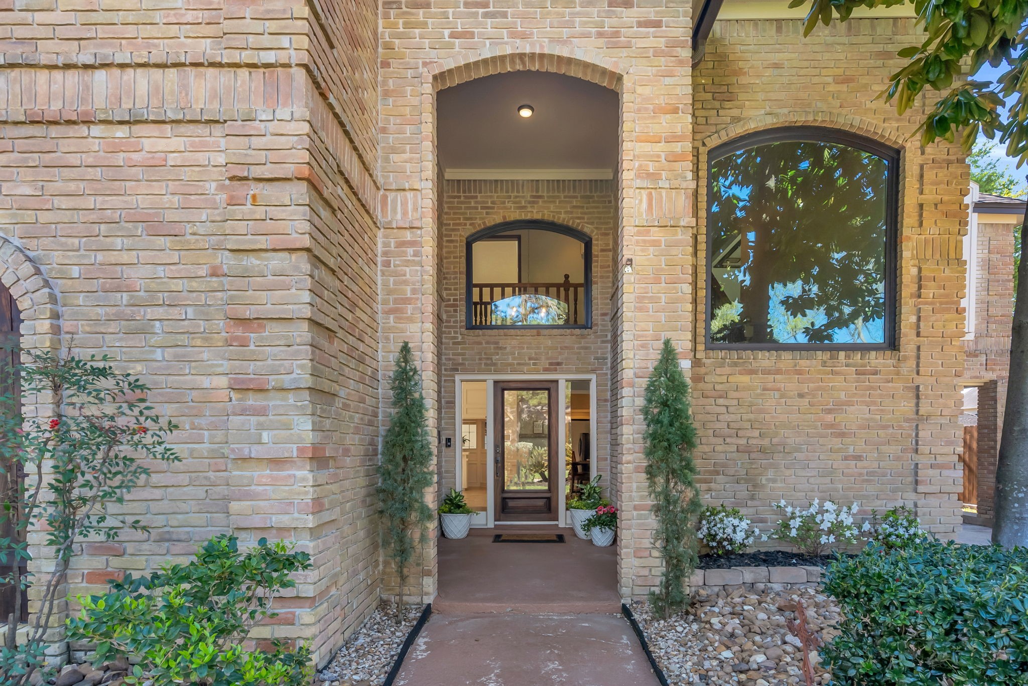 6034 Oak Creek Lane Spring, TX 77379 - Photo 4 of 42 Welcoming entryway featuring quoin brick pattern to create this beautiful elevation of this home. 6034 Oak Creek Ln., Spring, TX 77379