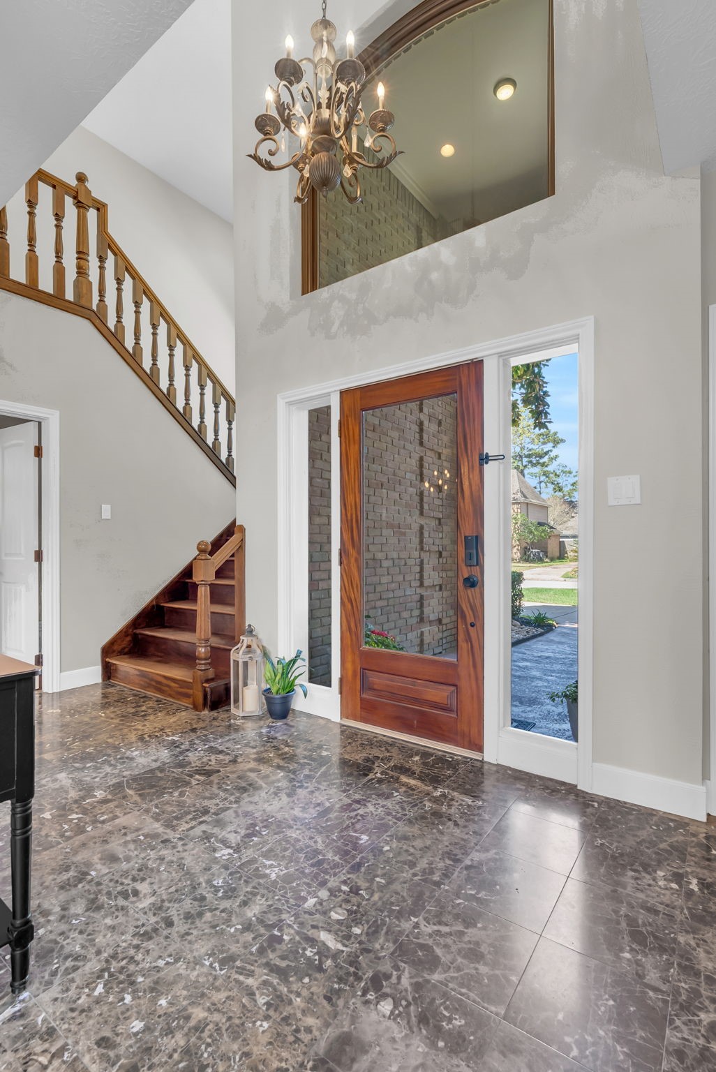 6034 Oak Creek Lane Spring, TX 77379 - Photo 5 of 42 A look back toward the 2 Story Foyer displaying a beautiful Chandelier & Glass Front Door! 6034 Oak Creek Ln., Spring, TX 77379
