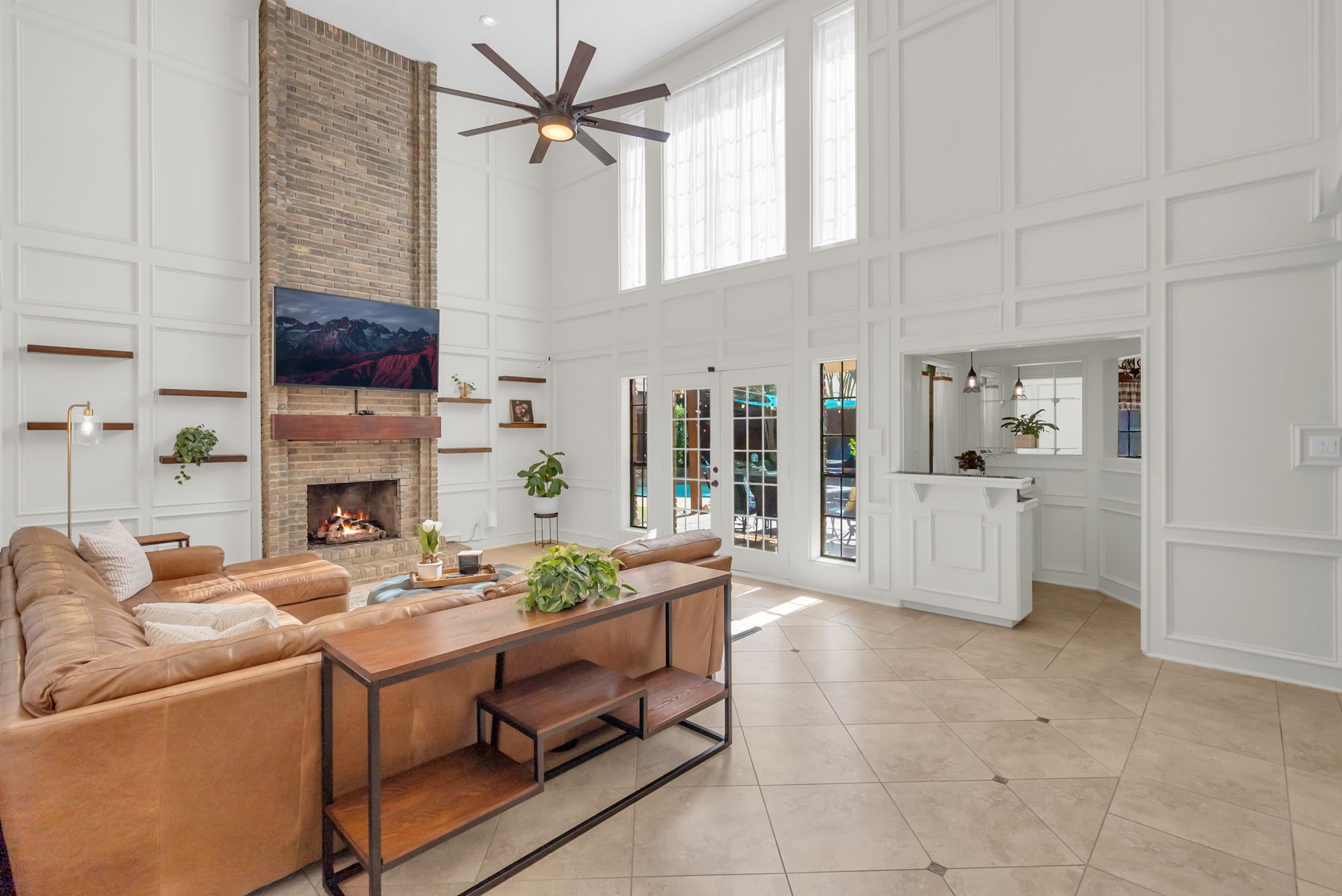 6034 Oak Creek Lane Spring, TX 77379 - Photo 7 of 42 This 2 Story Living Room features Custom Picture Framed Molding, Large Windows, Wet Bar/Coffee Bar and a Brick Fireplace! 6034 Oak Creek Ln., Spring, TX 77379