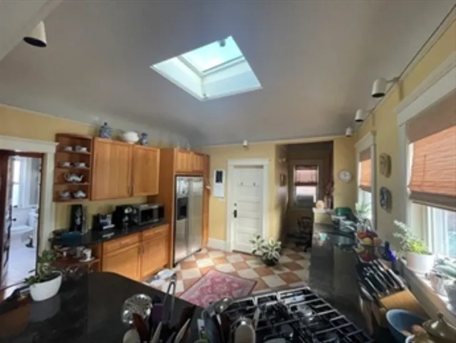 a room with lots of chairs and mirrors