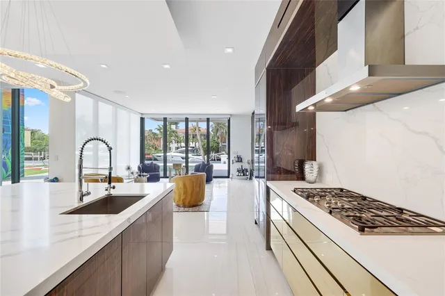 a view of a house with a swimming pool and sitting area
