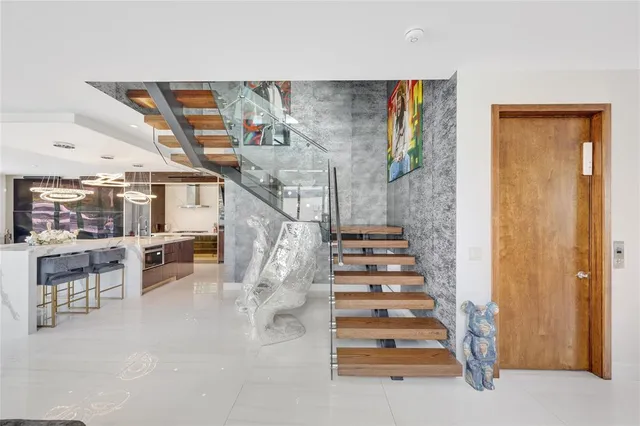 an aerial view of a house with a yard and potted plants