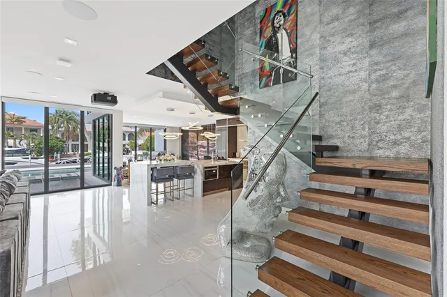a view of a kitchen with cabinets and wooden floor